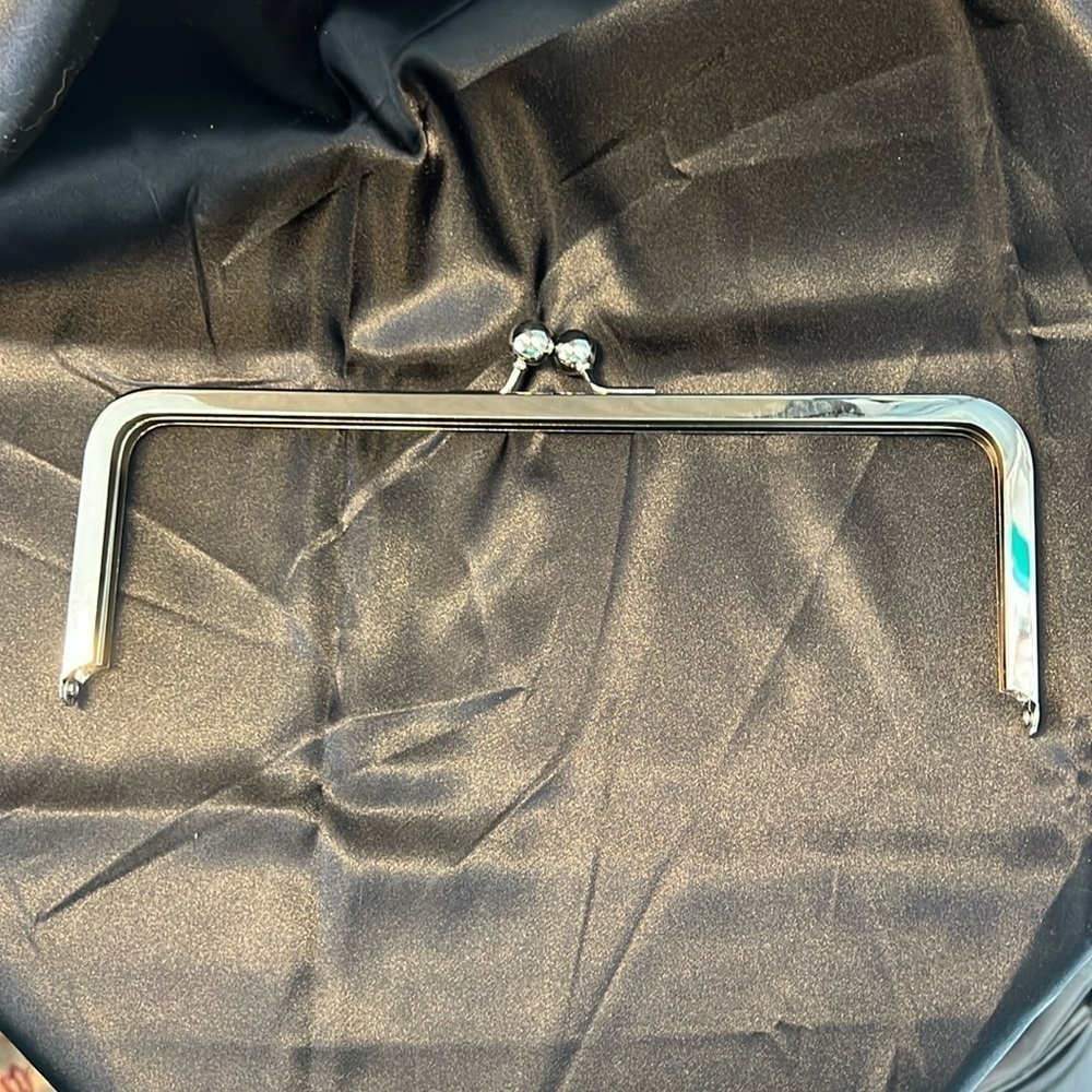Purse top frame with kiss closure. 10” x 3”. Silver tone.  Selling lot of 11